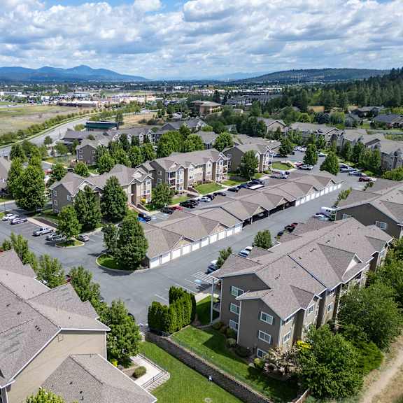 an aerial view of a neighborhood with houses and trees