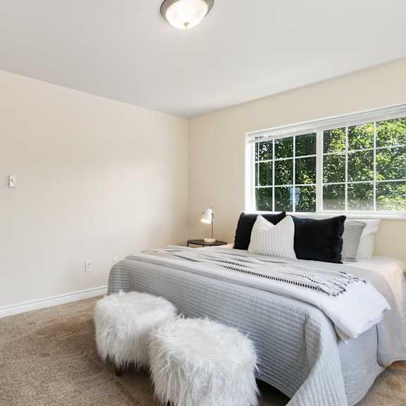 a bedroom with a bed and a white door