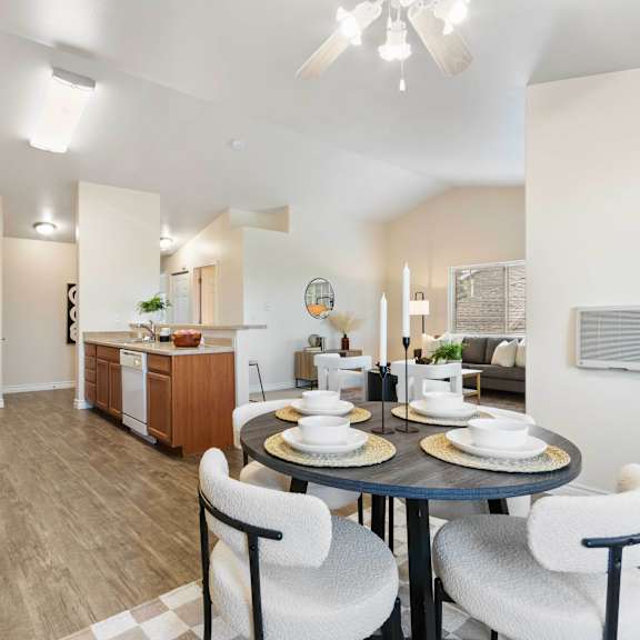 a dining room with a table and chairs