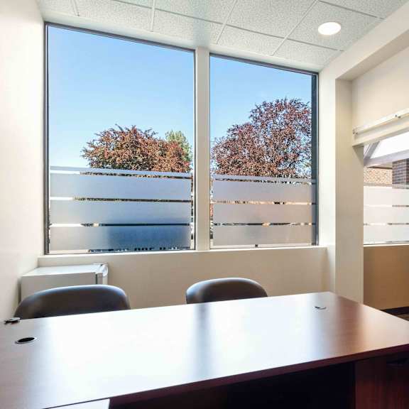 a office with a desk and a window