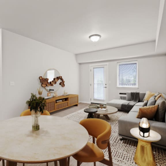 a modern living room with a round table and yellow chairs.