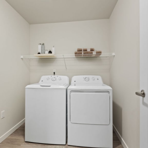a small laundry room with a washer and dryer.