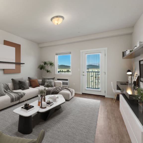 a living room with a white couch, a coffee table, and a chair.