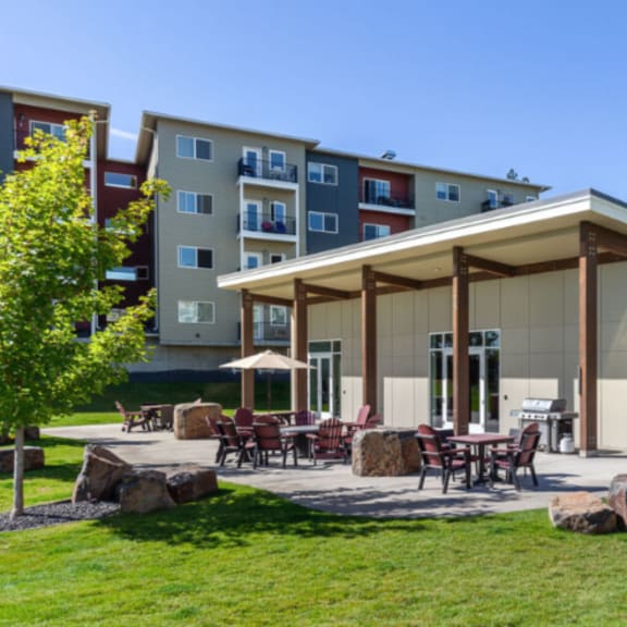 a building with a covered patio area in front of it.