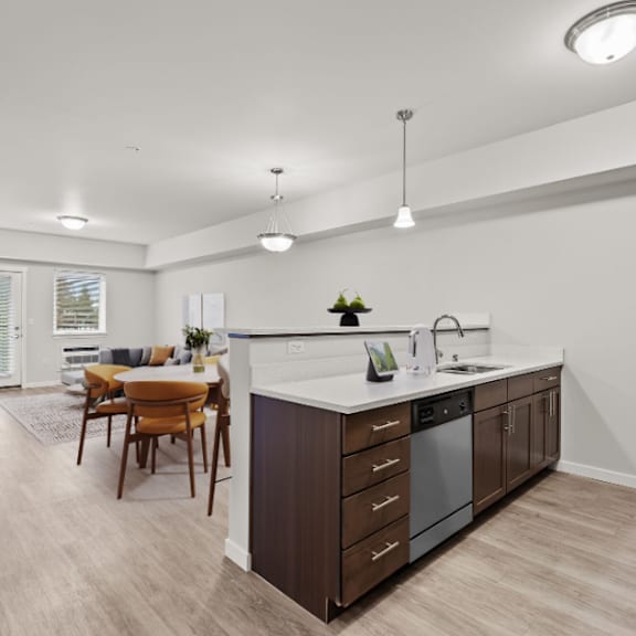 a modern kitchen with a dining table and chairs.