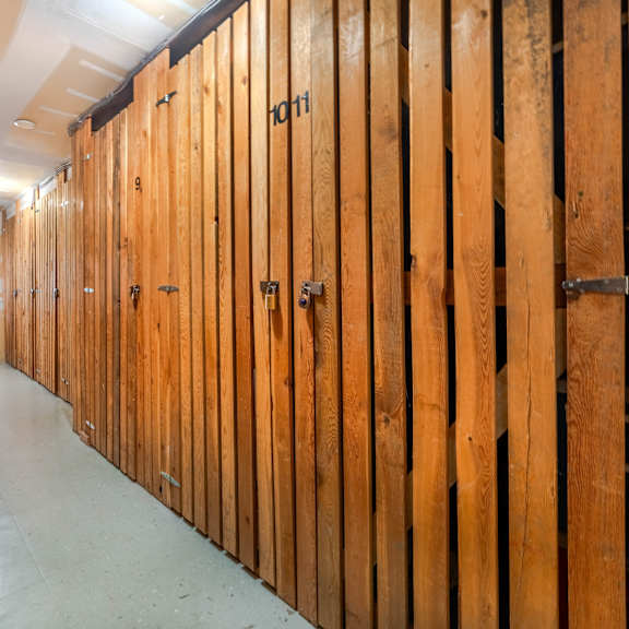 a room under construction with wooden walls and floor.