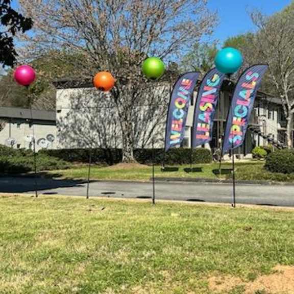 a street with a bunch of balloons on the side of it