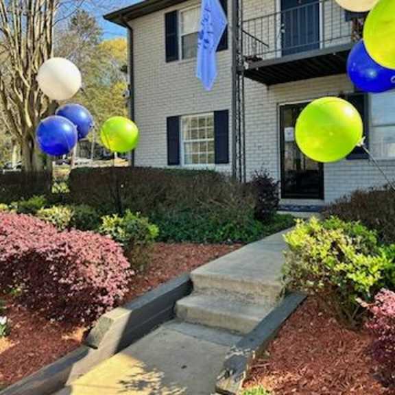 a house with a bunch of balloons in front of it