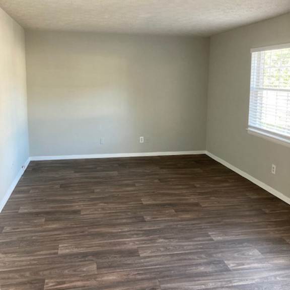 an empty room with a skylight