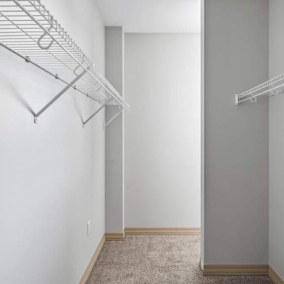 empty room with white walls and a carpeted floor.