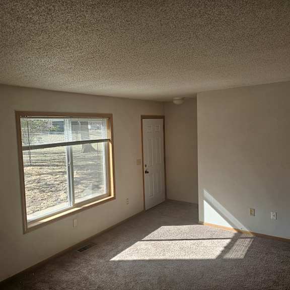 a room with a window and a door.