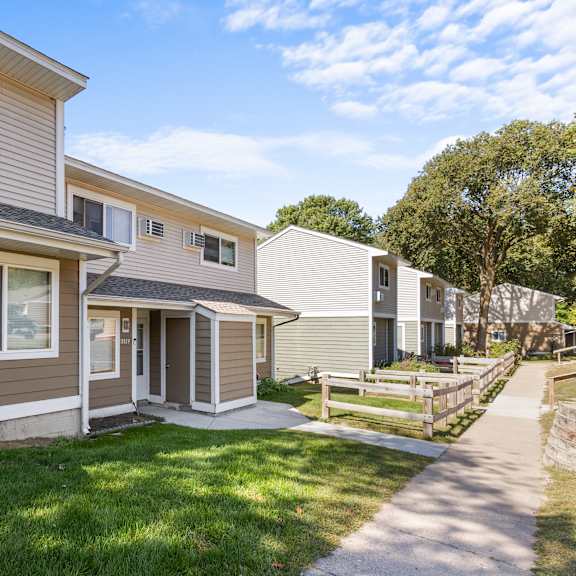 a row of houses with a clear blue sky above them.