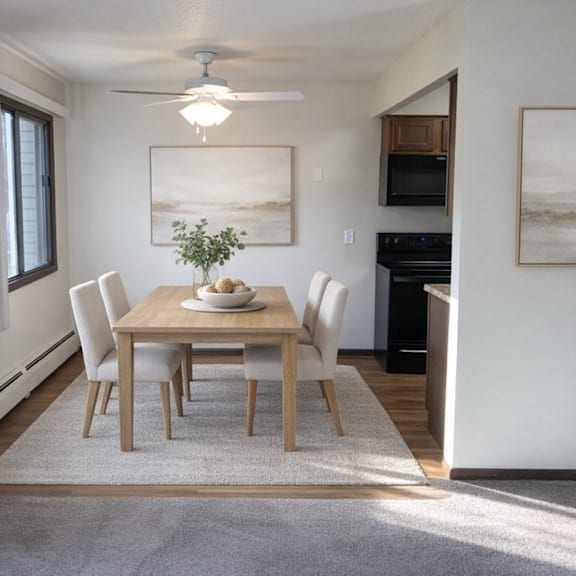 a dining room with a table set for four.