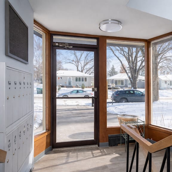 a view from inside a house looking out through a glass door.