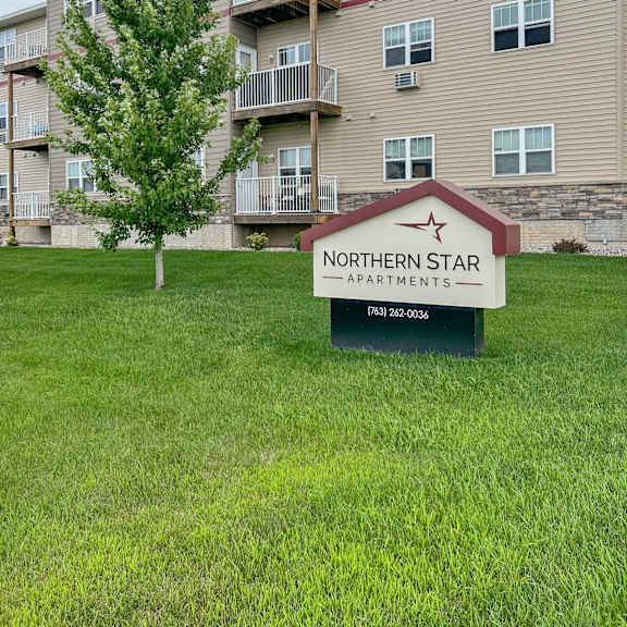 a building with a sign that says northern star apartments in front of it.