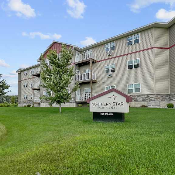 a building with a sign that says "northern star apartments".