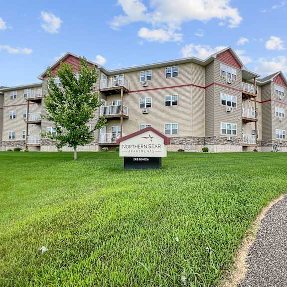 apartment complex named northern star with a sign in front.