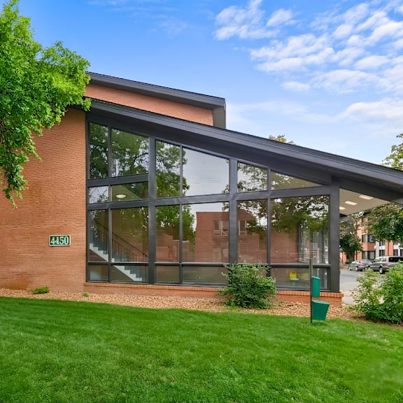 a modern house with a glass wall extension.