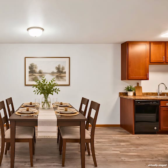 a dining room with a table set for a meal.
