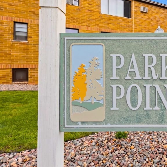 a sign that says park point in front of a building.