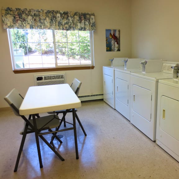 a laundry room with a washer and dryer.