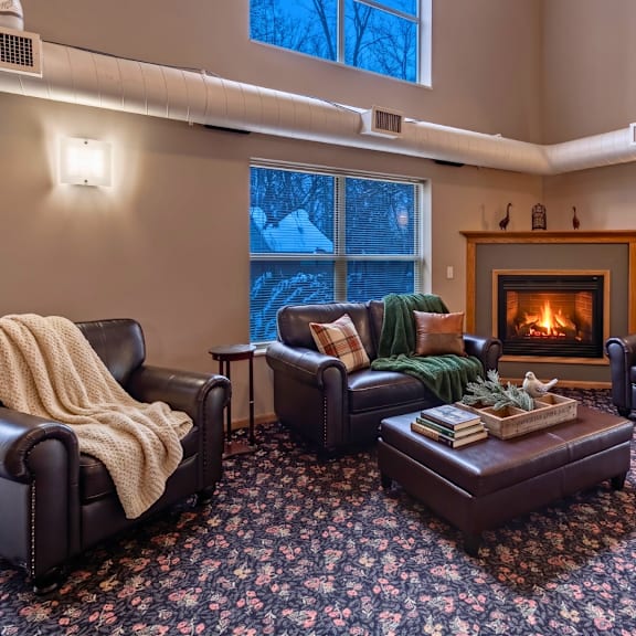 a cozy living room with a fireplace and comfortable seating.