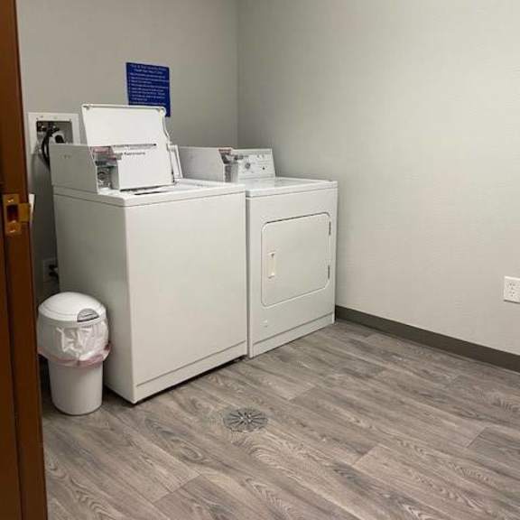 a white washing machine and dryer in a small room.