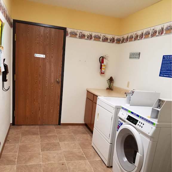 a laundry room with a washer and dryer.
