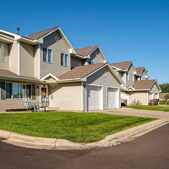 a row of houses with a clear blue sky above them.