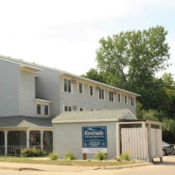 a grey building with a sign that says riverside on it.