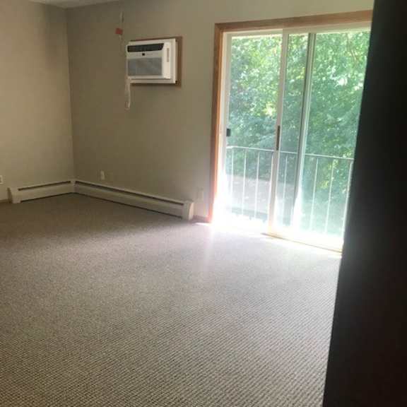 a room with a window and a door.