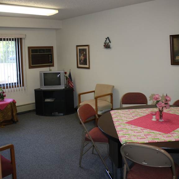 a room with a table set for a meal.