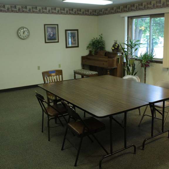 a conference room with a long table and chairs.