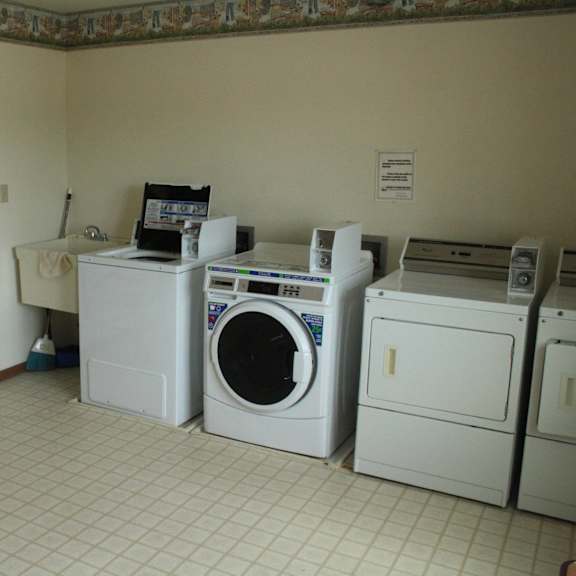 a laundry room with a washer and dryer.