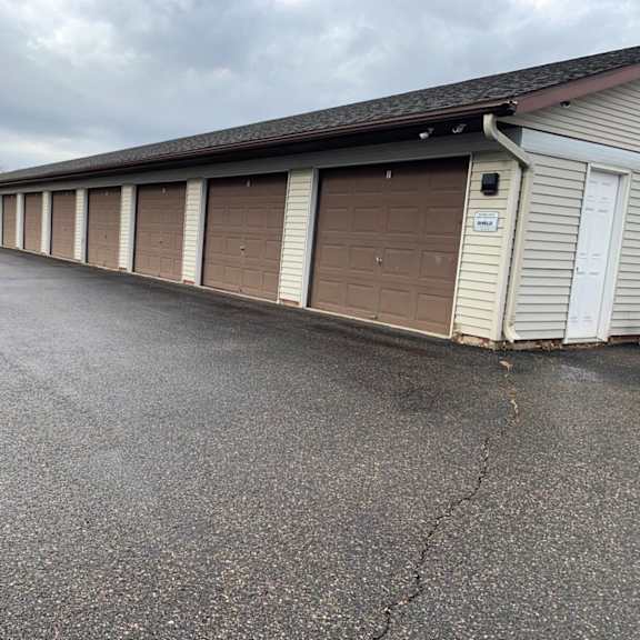 a long row of garage doors are closed.