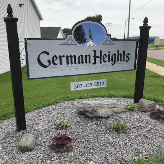 a sign for german heights with a phone number on it.