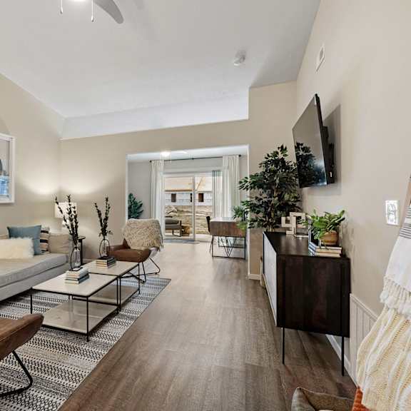 a living room with a couch and a tv
