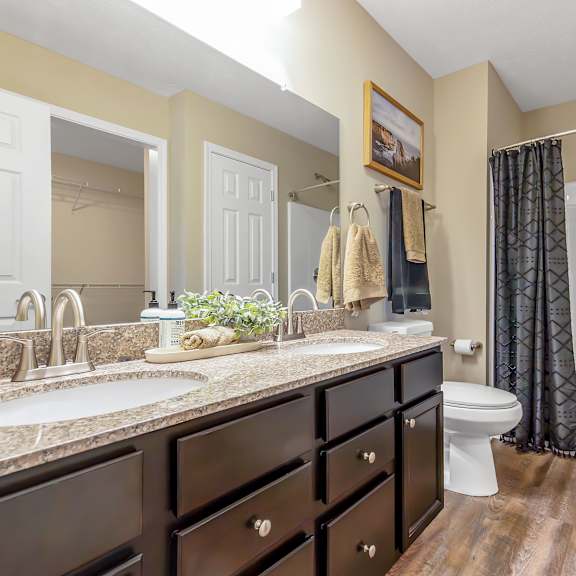 a bathroom with a sink, toilet, and bathtub.
