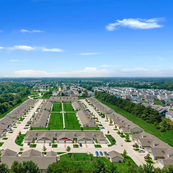 a suburban neighborhood with a large green space in the center.