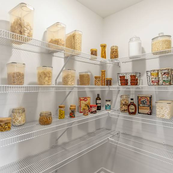 a pantry with a variety of food items on the shelves.