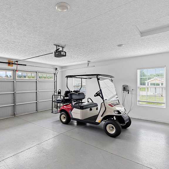 a golf cart is parked inside a garage.