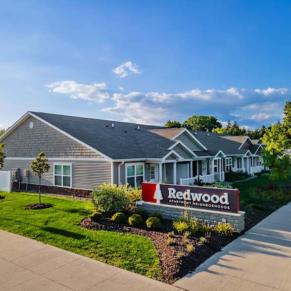 a house with a sign that says redwood in front of it.