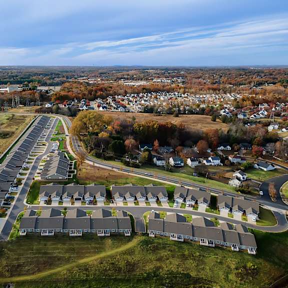 a suburban neighborhood with a road and houses.