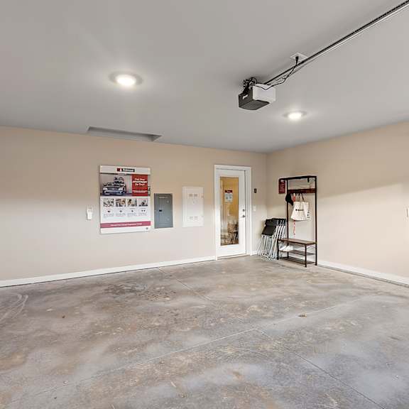 a room with a concrete floor and a white ceiling.