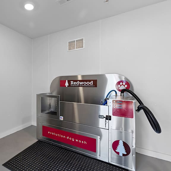 a redwood washing machine in a clean, white room.