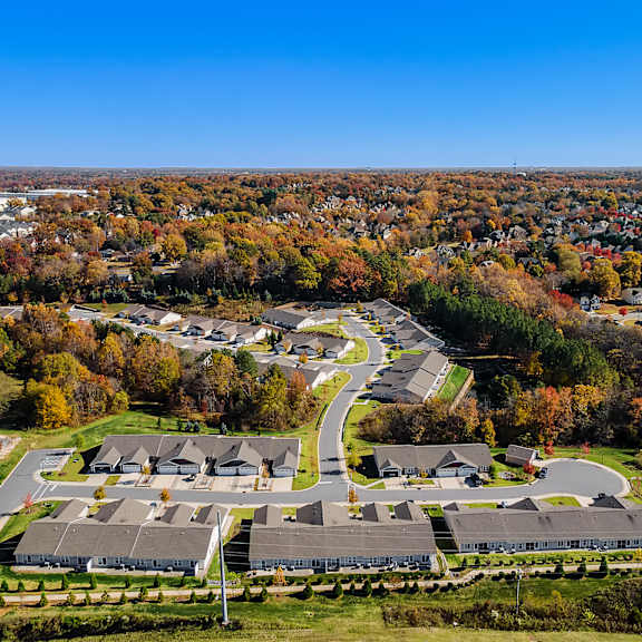 a bird's eye view of a residential area with houses and trees.
