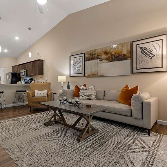 a living room with a white couch and a coffee table.