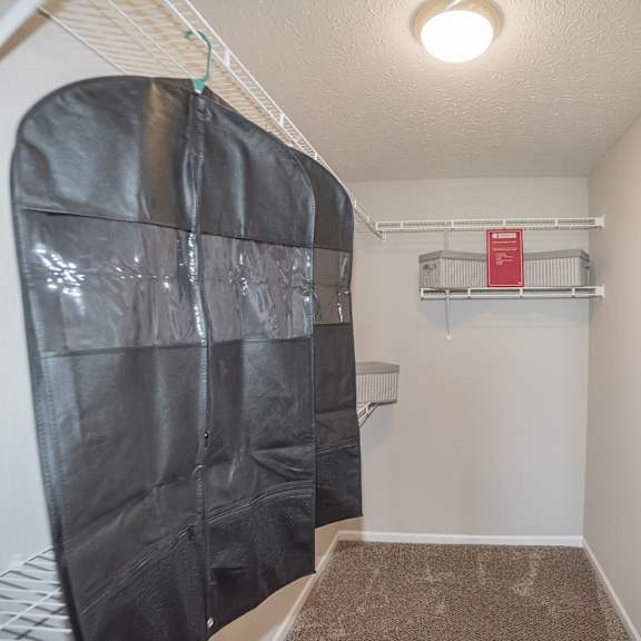 a room with a carpeted floor and a white wall.