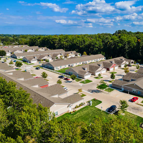 a bird's eye view of a residential area with houses and cars.