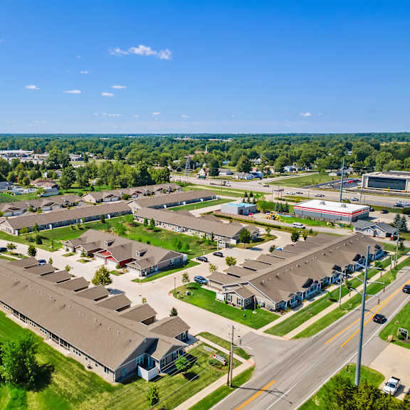 a bird's eye view of a residential area with houses and a large building.